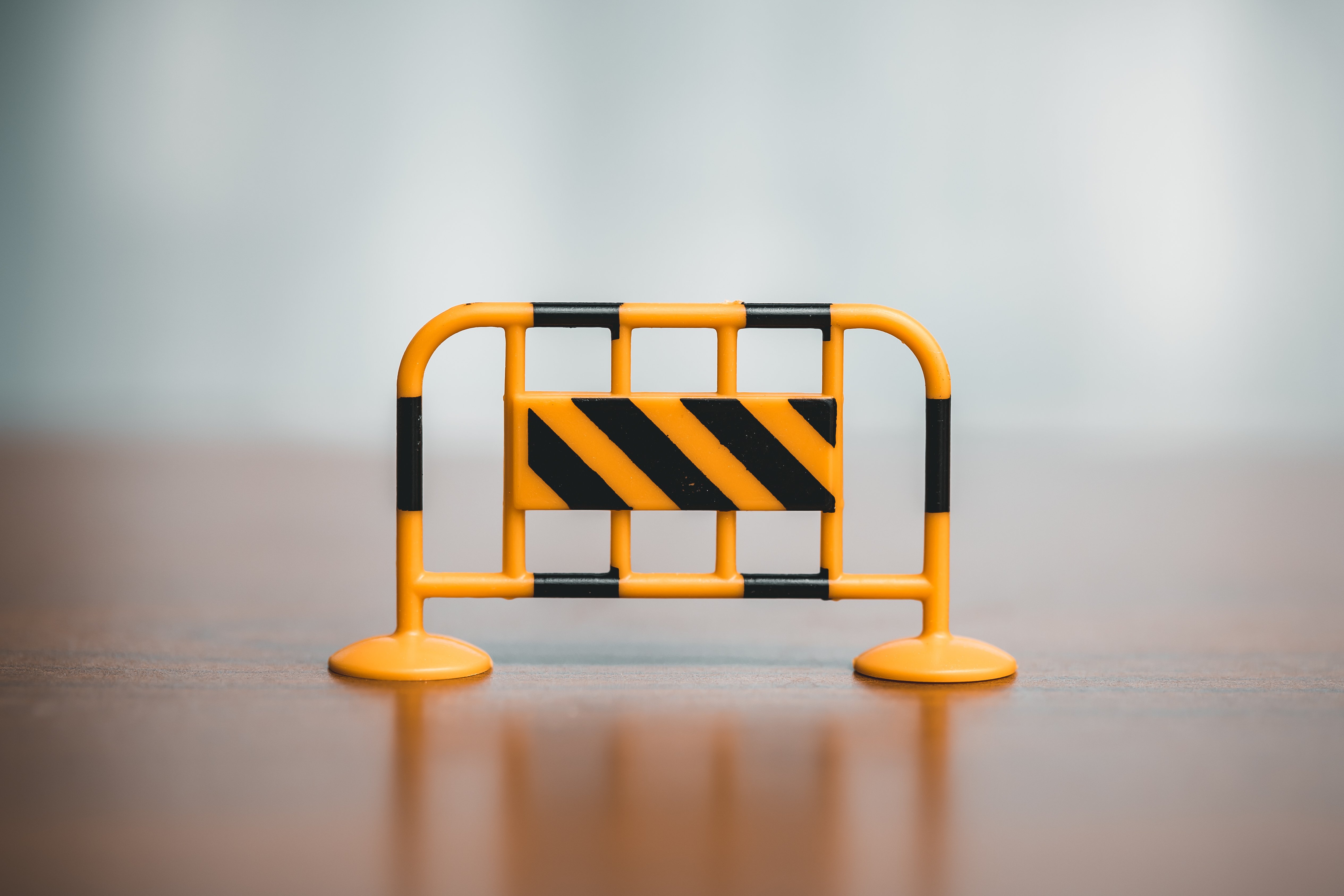 vecteezy_traffic-barrier-on-the-wooden-floor-in-front-of-a-blurred_40886190