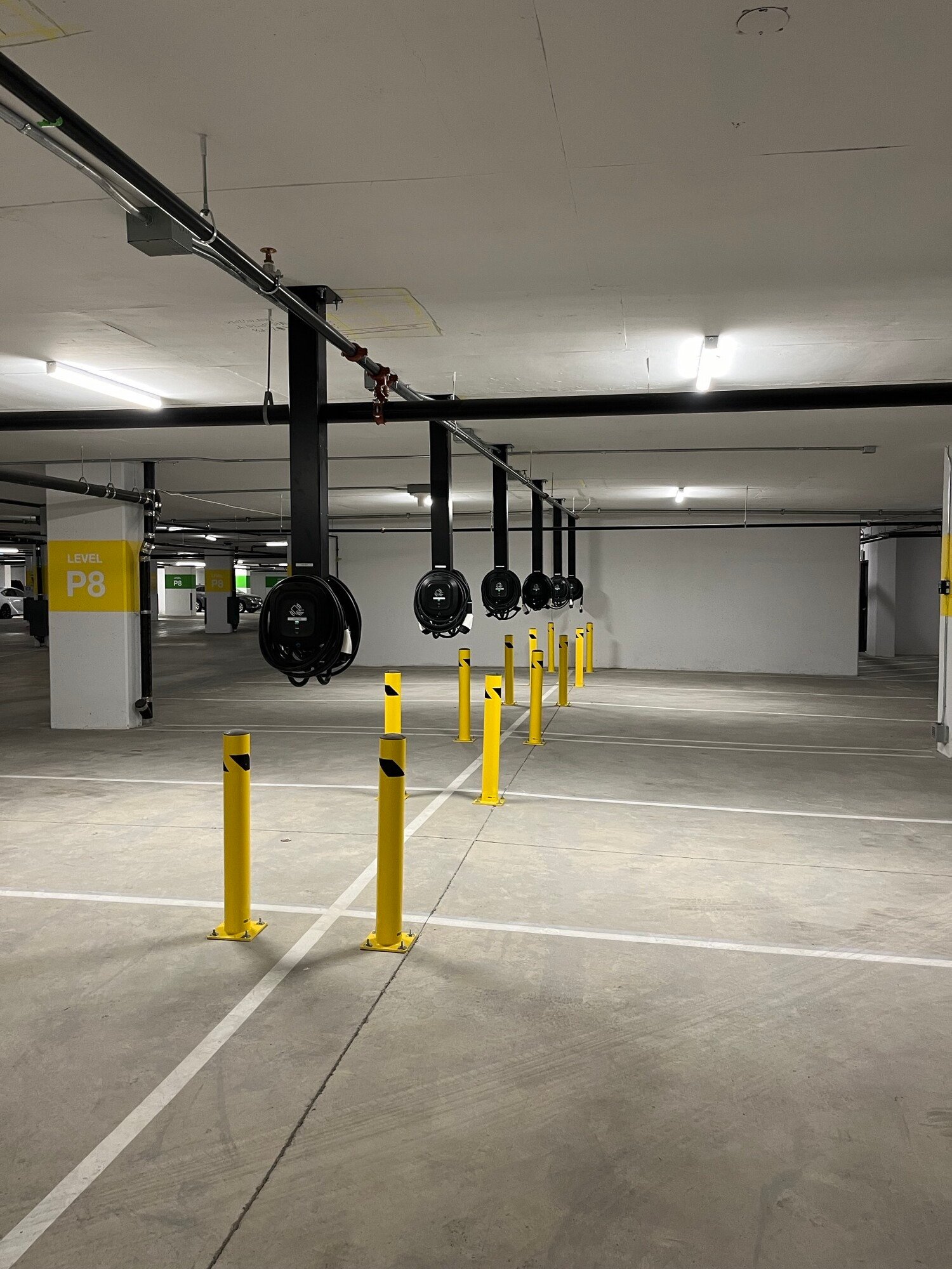 EV chargers on ceiling mounted pedestals