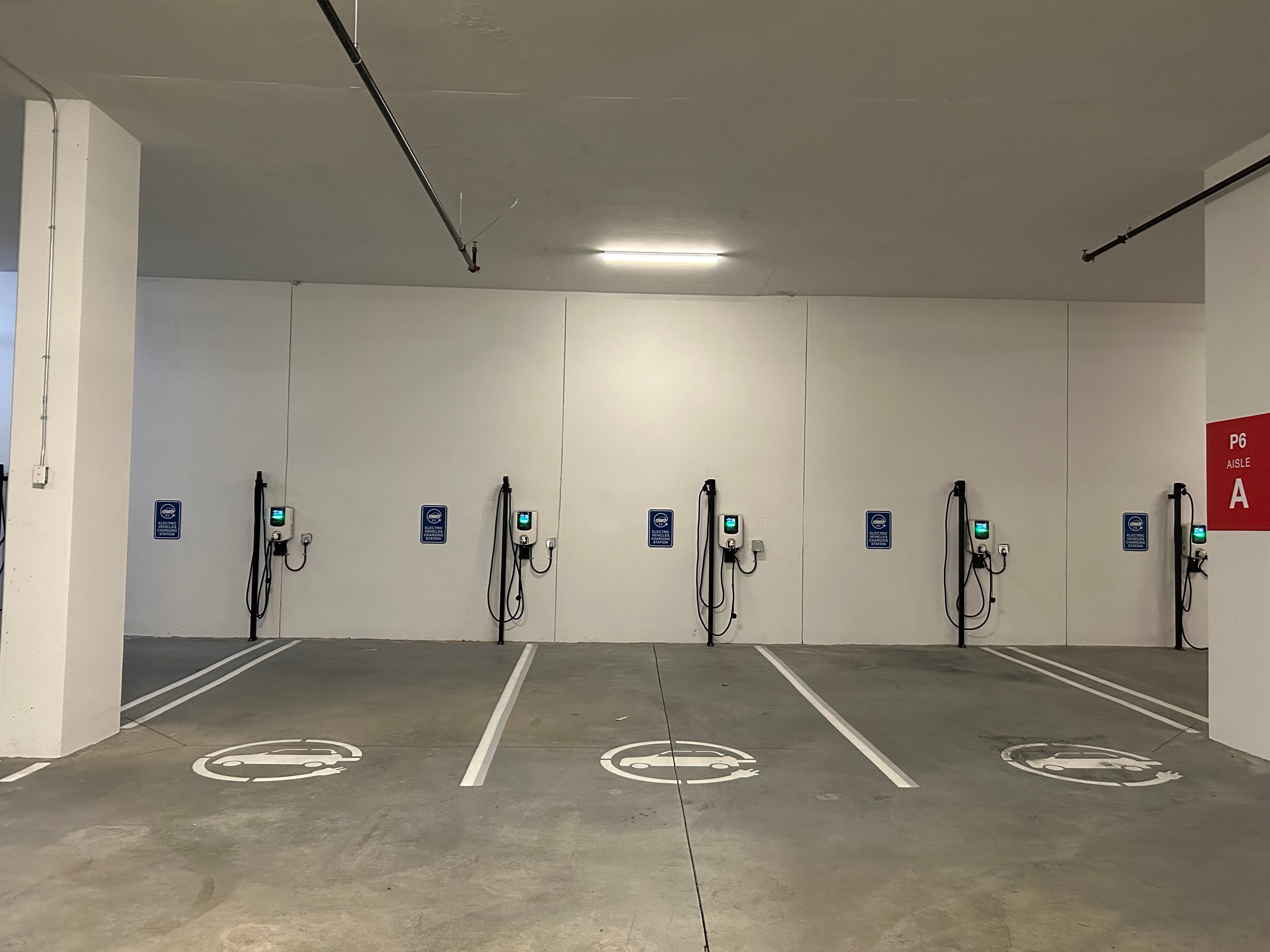 A row of EV charging stations for commercial use at the City of Lougheed Shopping Centre